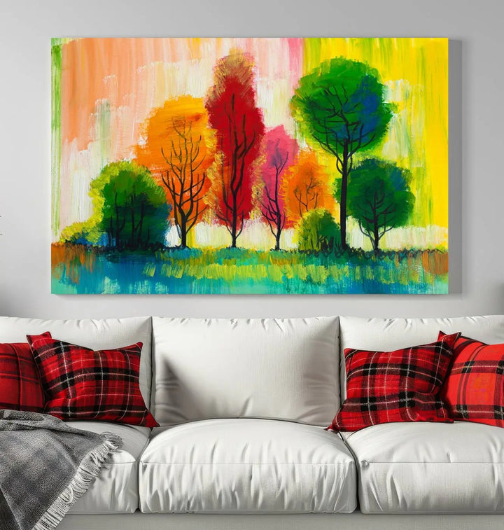 A modern living room features the "Colorful Trees Wall Art Canvas Print" on museum-quality canvases.