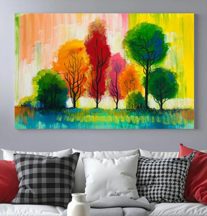 A modern living room features the "Colorful Trees Wall Art Canvas Print" on museum-quality canvases.