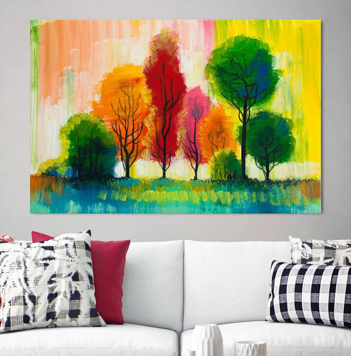 A modern living room features the "Colorful Trees Wall Art Canvas Print" on museum-quality canvases.