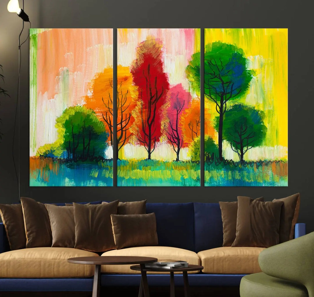 A modern living room features the "Colorful Trees Wall Art Canvas Print" on museum-quality canvases.