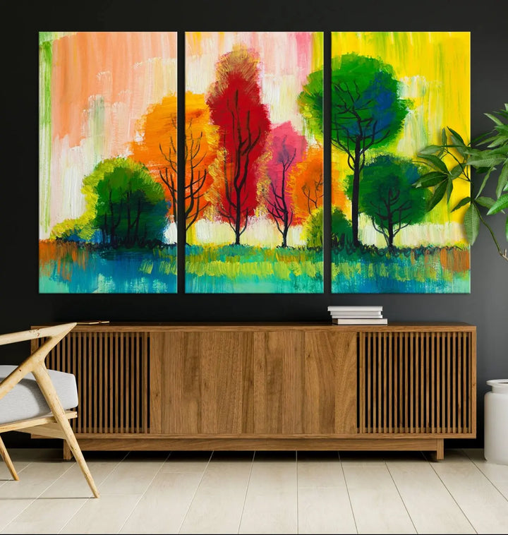 A modern living room features the "Colorful Trees Wall Art Canvas Print" on museum-quality canvases.