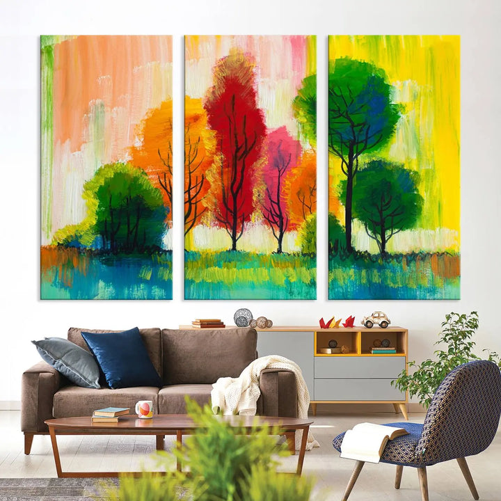 A modern living room features the "Colorful Trees Wall Art Canvas Print" on museum-quality canvases.