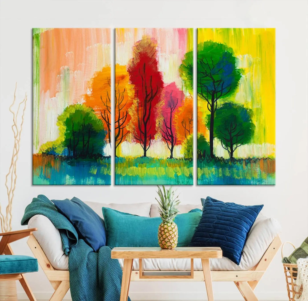 A modern living room features the "Colorful Trees Wall Art Canvas Print" on museum-quality canvases.