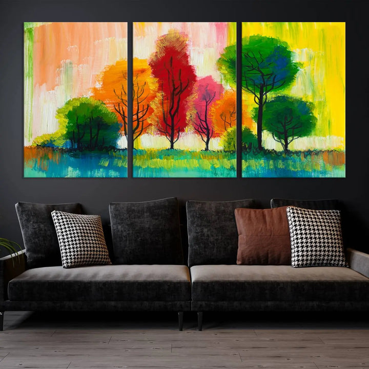 A modern living room features the "Colorful Trees Wall Art Canvas Print" on museum-quality canvases.