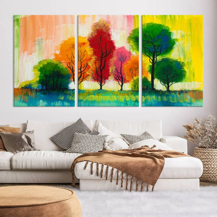 A modern living room features the "Colorful Trees Wall Art Canvas Print" on museum-quality canvases.