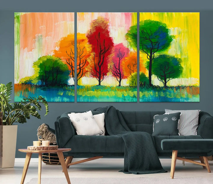 A modern living room features the "Colorful Trees Wall Art Canvas Print" on museum-quality canvases.