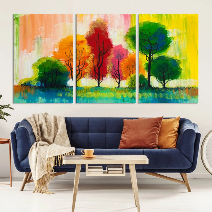 A modern living room features the "Colorful Trees Wall Art Canvas Print" on museum-quality canvases.