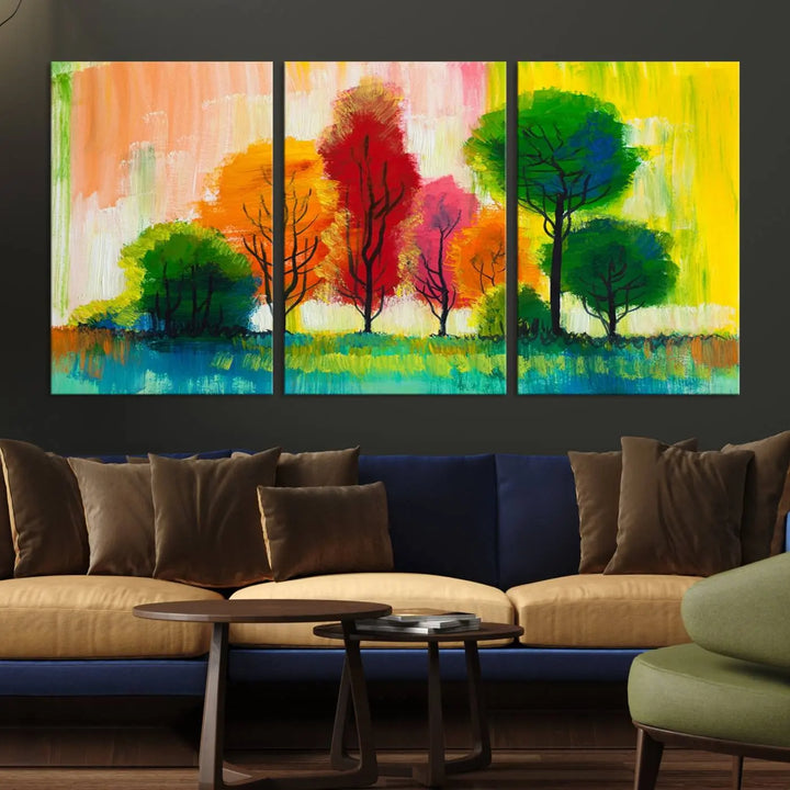 A modern living room features the "Colorful Trees Wall Art Canvas Print" on museum-quality canvases.