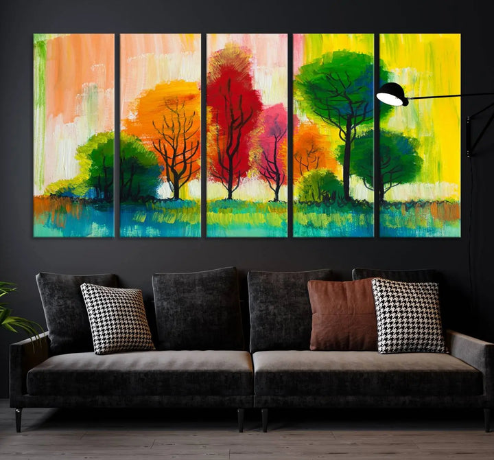 A modern living room features the "Colorful Trees Wall Art Canvas Print" on museum-quality canvases.