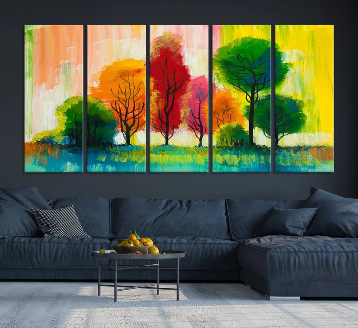 A modern living room features the "Colorful Trees Wall Art Canvas Print" on museum-quality canvases.