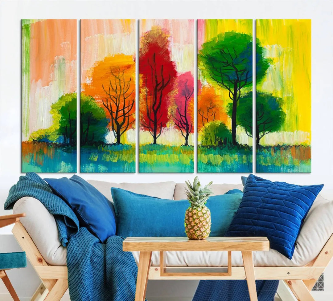 A modern living room features the "Colorful Trees Wall Art Canvas Print" on museum-quality canvases.