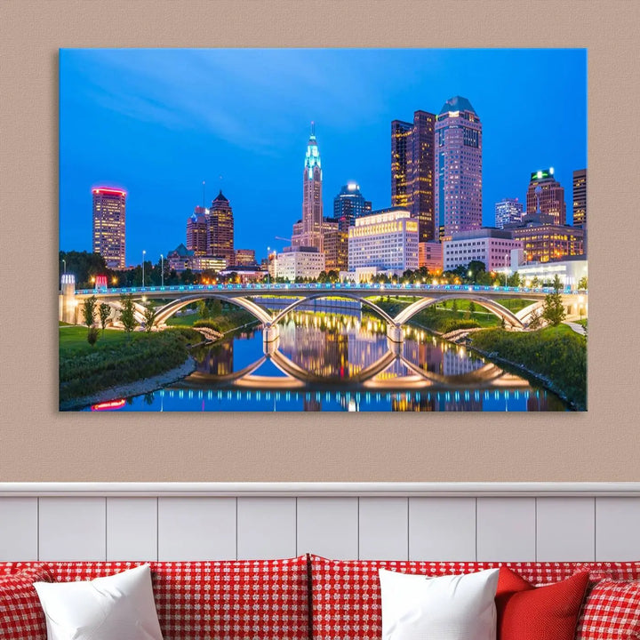 The modern living room is enhanced by the striking Columbus City Lights Bright Blue Skyline Cityscape View Wall Art Canvas Print displayed above white cabinets. This piece is crafted on museum-quality canvas with a UV-protective coating to ensure lasting beauty and vibrant colors.