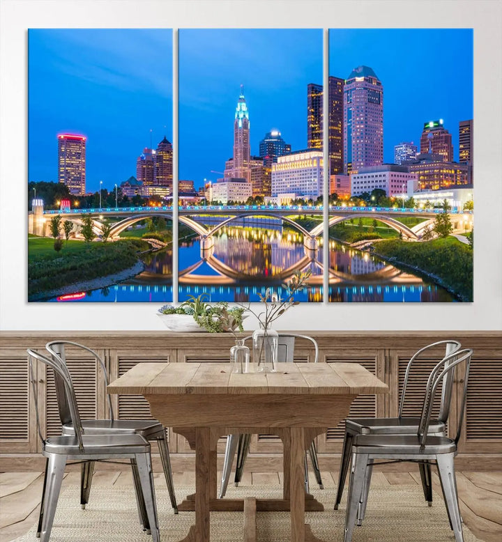 The modern living room is enhanced by the striking Columbus City Lights Bright Blue Skyline Cityscape View Wall Art Canvas Print displayed above white cabinets. This piece is crafted on museum-quality canvas with a UV-protective coating to ensure lasting beauty and vibrant colors.