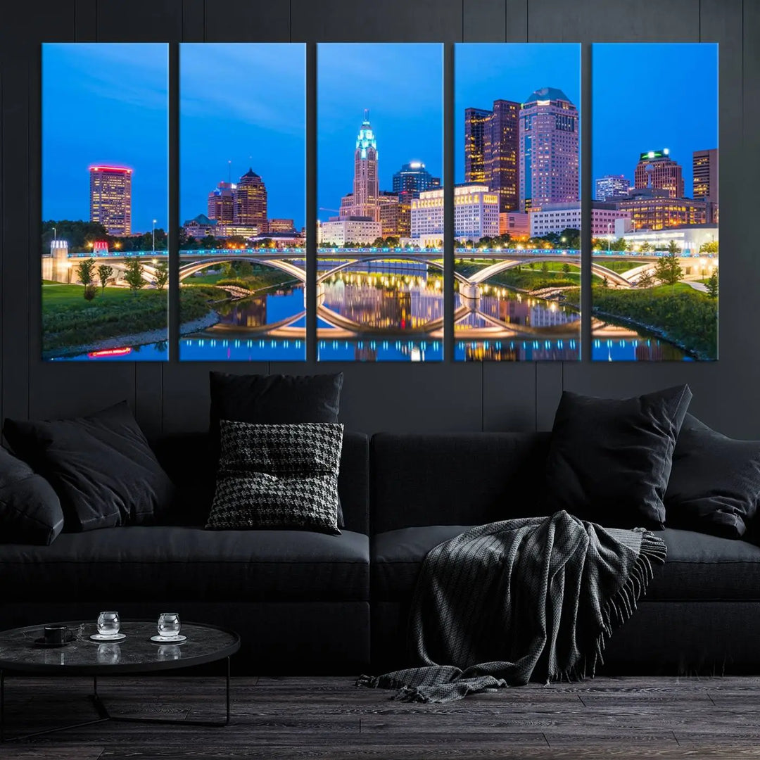 The modern living room is enhanced by the striking Columbus City Lights Bright Blue Skyline Cityscape View Wall Art Canvas Print displayed above white cabinets. This piece is crafted on museum-quality canvas with a UV-protective coating to ensure lasting beauty and vibrant colors.