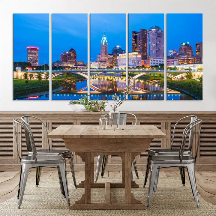 The modern living room is enhanced by the striking Columbus City Lights Bright Blue Skyline Cityscape View Wall Art Canvas Print displayed above white cabinets. This piece is crafted on museum-quality canvas with a UV-protective coating to ensure lasting beauty and vibrant colors.