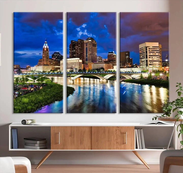 Columbus City Lights Night Bright Blue Cloudy Skyline Cityscape View Wall Art Canvas Print, gallery wrapped on museum-quality canvas, reflecting on a river.