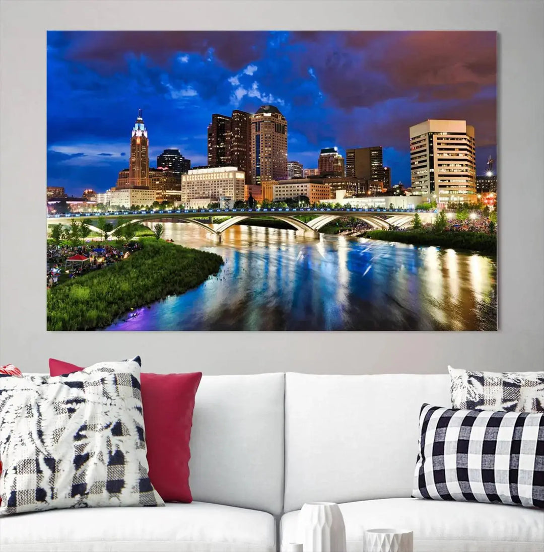 Columbus City Lights Night Bright Blue Cloudy Skyline Cityscape View Wall Art Canvas Print, gallery wrapped on museum-quality canvas, reflecting on a river.