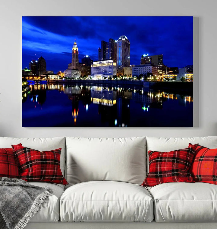 The living room showcases the Columbus City Lights Night Bright Blue Skyline Cityscape View Wall Art Canvas Print on a museum-quality canvas. The professionally hand-assembled artwork adds elegance while ensuring durable beauty.