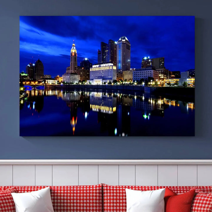 The living room showcases the Columbus City Lights Night Bright Blue Skyline Cityscape View Wall Art Canvas Print on a museum-quality canvas. The professionally hand-assembled artwork adds elegance while ensuring durable beauty.