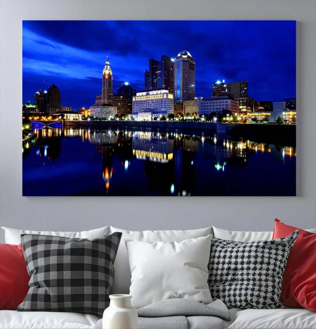 The living room showcases the Columbus City Lights Night Bright Blue Skyline Cityscape View Wall Art Canvas Print on a museum-quality canvas. The professionally hand-assembled artwork adds elegance while ensuring durable beauty.