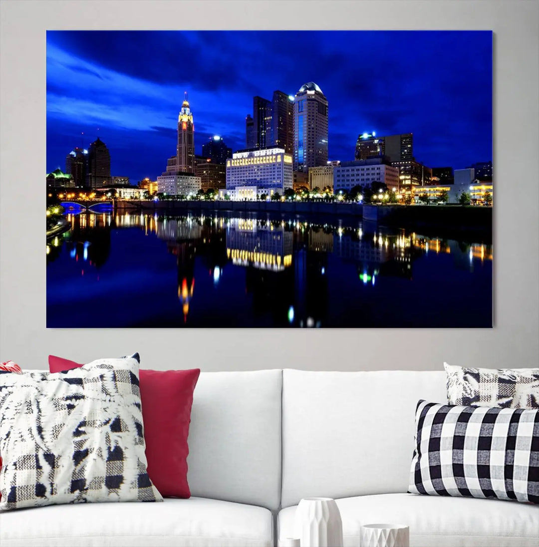 The living room showcases the Columbus City Lights Night Bright Blue Skyline Cityscape View Wall Art Canvas Print on a museum-quality canvas. The professionally hand-assembled artwork adds elegance while ensuring durable beauty.