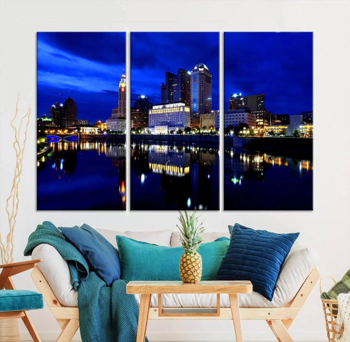 The living room showcases the Columbus City Lights Night Bright Blue Skyline Cityscape View Wall Art Canvas Print on a museum-quality canvas. The professionally hand-assembled artwork adds elegance while ensuring durable beauty.