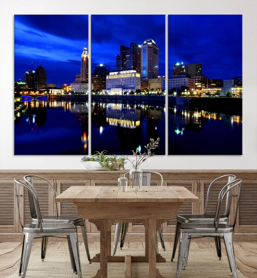 The living room showcases the Columbus City Lights Night Bright Blue Skyline Cityscape View Wall Art Canvas Print on a museum-quality canvas. The professionally hand-assembled artwork adds elegance while ensuring durable beauty.