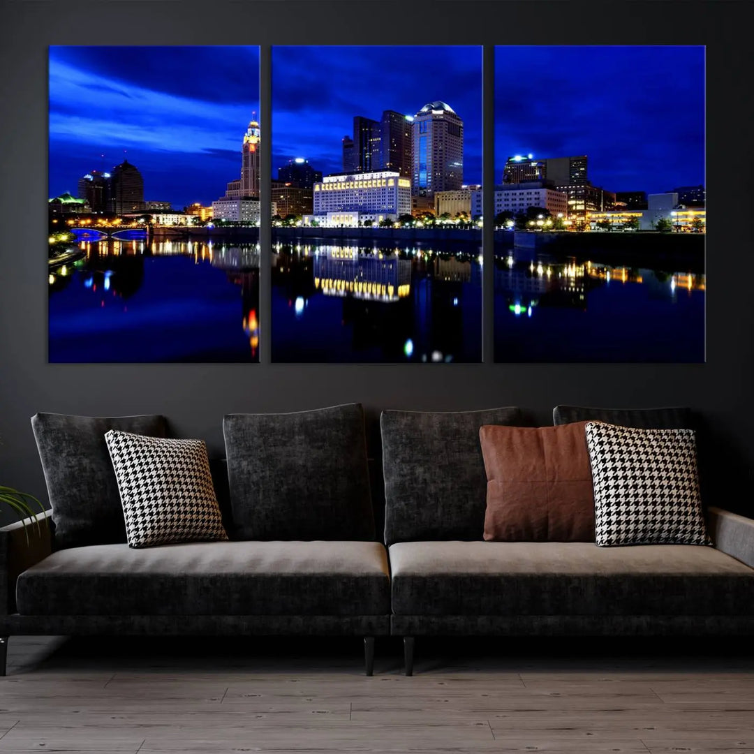 The living room showcases the Columbus City Lights Night Bright Blue Skyline Cityscape View Wall Art Canvas Print on a museum-quality canvas. The professionally hand-assembled artwork adds elegance while ensuring durable beauty.