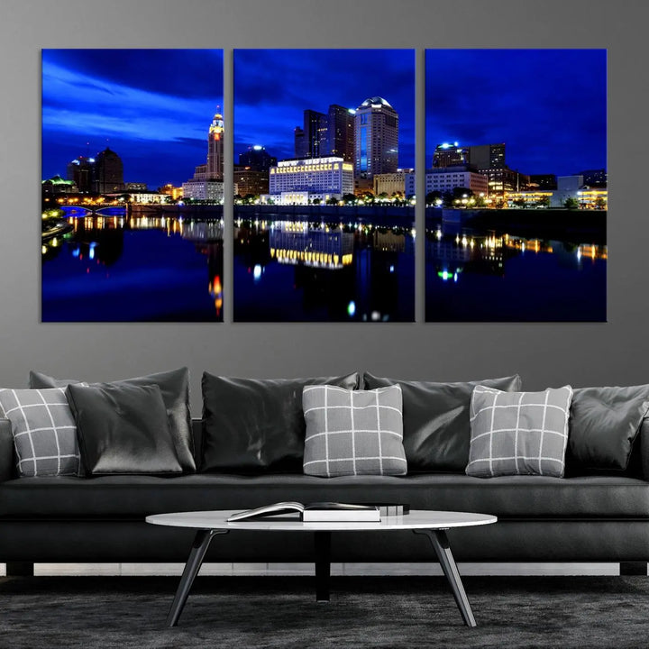 The living room showcases the Columbus City Lights Night Bright Blue Skyline Cityscape View Wall Art Canvas Print on a museum-quality canvas. The professionally hand-assembled artwork adds elegance while ensuring durable beauty.