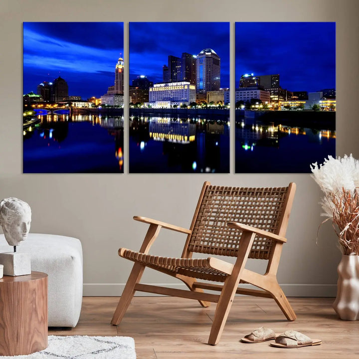 The living room showcases the Columbus City Lights Night Bright Blue Skyline Cityscape View Wall Art Canvas Print on a museum-quality canvas. The professionally hand-assembled artwork adds elegance while ensuring durable beauty.