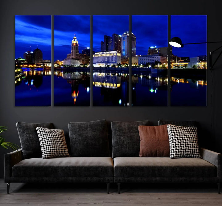 The living room showcases the Columbus City Lights Night Bright Blue Skyline Cityscape View Wall Art Canvas Print on a museum-quality canvas. The professionally hand-assembled artwork adds elegance while ensuring durable beauty.