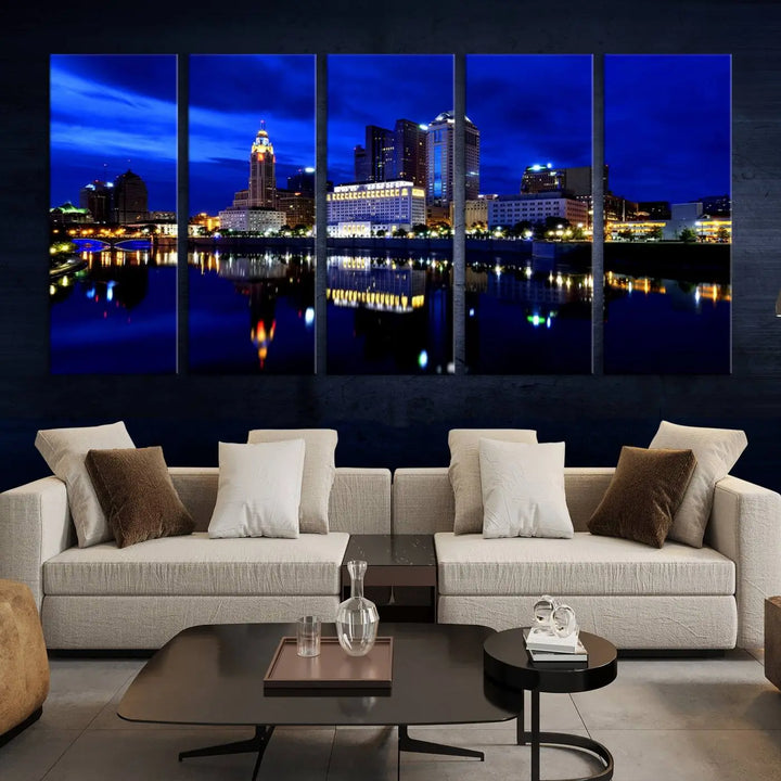 The living room showcases the Columbus City Lights Night Bright Blue Skyline Cityscape View Wall Art Canvas Print on a museum-quality canvas. The professionally hand-assembled artwork adds elegance while ensuring durable beauty.