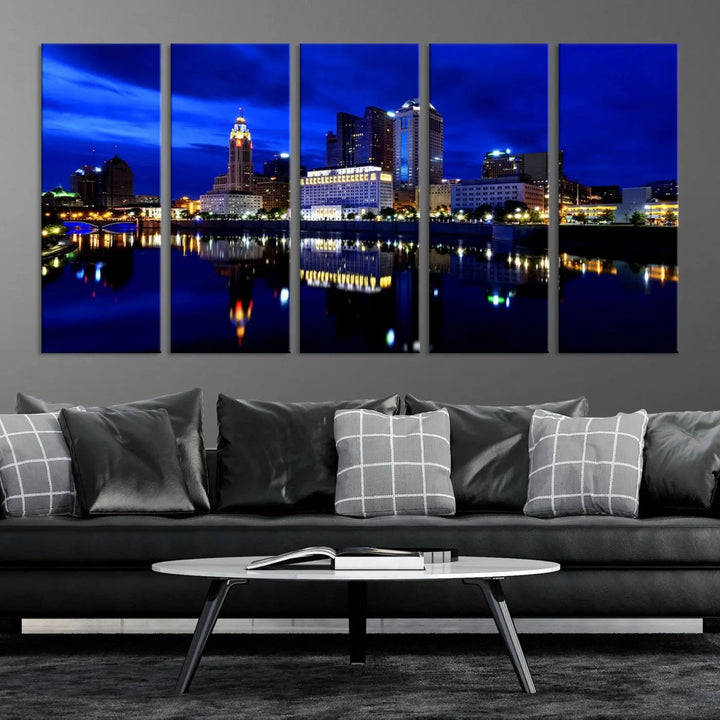 The living room showcases the Columbus City Lights Night Bright Blue Skyline Cityscape View Wall Art Canvas Print on a museum-quality canvas. The professionally hand-assembled artwork adds elegance while ensuring durable beauty.