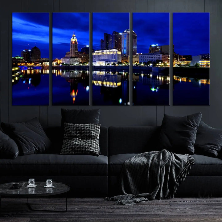 The living room showcases the Columbus City Lights Night Bright Blue Skyline Cityscape View Wall Art Canvas Print on a museum-quality canvas. The professionally hand-assembled artwork adds elegance while ensuring durable beauty.