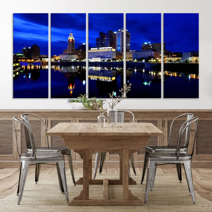 The living room showcases the Columbus City Lights Night Bright Blue Skyline Cityscape View Wall Art Canvas Print on a museum-quality canvas. The professionally hand-assembled artwork adds elegance while ensuring durable beauty.