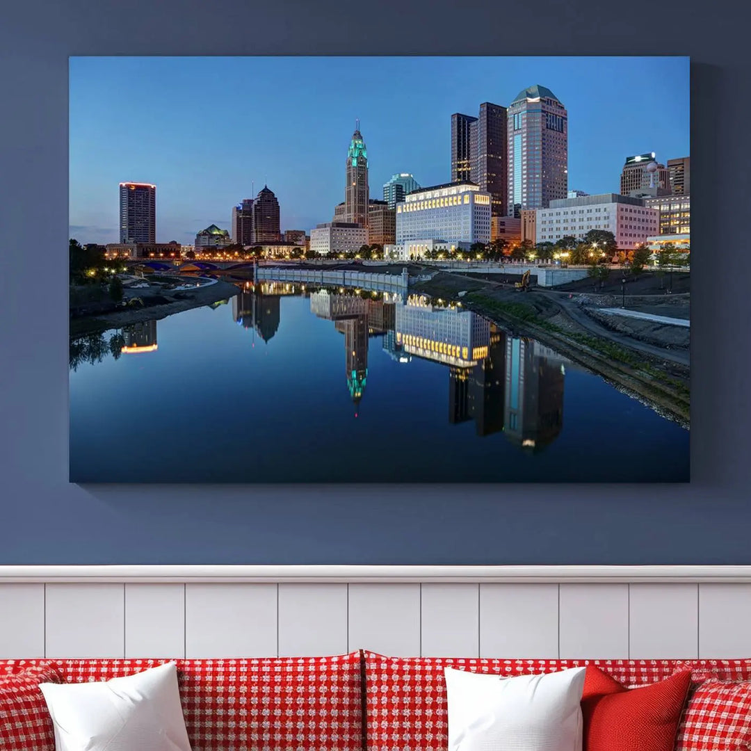 Enhance your modern dining area with the "Columbus City Lights Night Skyline Cityscape View Wall Art Canvas Print," capturing an urban scene of a cityscape mirrored on a tranquil river at dusk. This museum-quality canvas includes a UV-protective coating, guaranteeing its long-lasting brilliance. Enjoy free shipping while adding this piece of urban tranquility to your home.