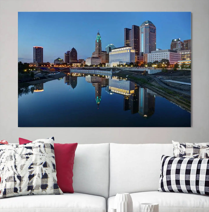 Enhance your modern dining area with the "Columbus City Lights Night Skyline Cityscape View Wall Art Canvas Print," capturing an urban scene of a cityscape mirrored on a tranquil river at dusk. This museum-quality canvas includes a UV-protective coating, guaranteeing its long-lasting brilliance. Enjoy free shipping while adding this piece of urban tranquility to your home.