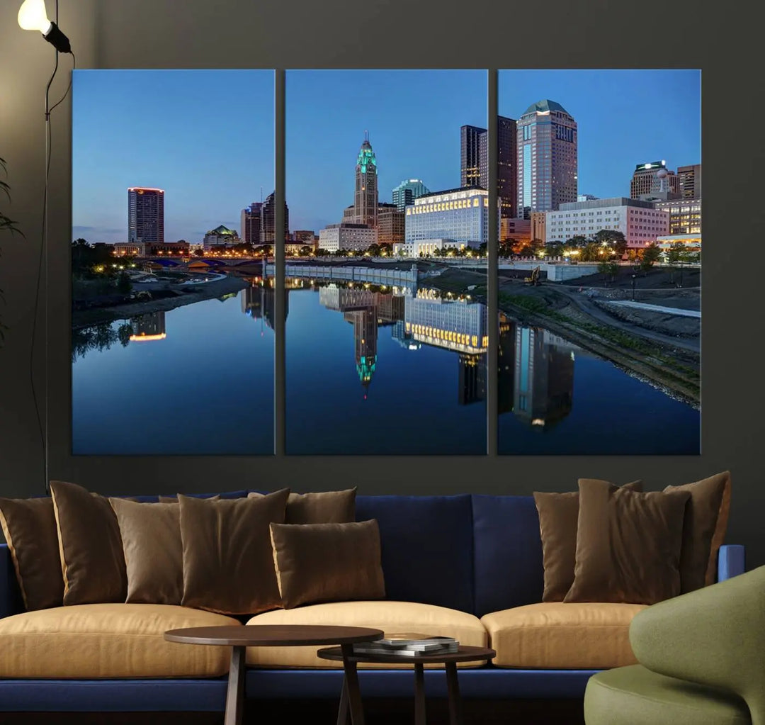 Enhance your modern dining area with the "Columbus City Lights Night Skyline Cityscape View Wall Art Canvas Print," capturing an urban scene of a cityscape mirrored on a tranquil river at dusk. This museum-quality canvas includes a UV-protective coating, guaranteeing its long-lasting brilliance. Enjoy free shipping while adding this piece of urban tranquility to your home.