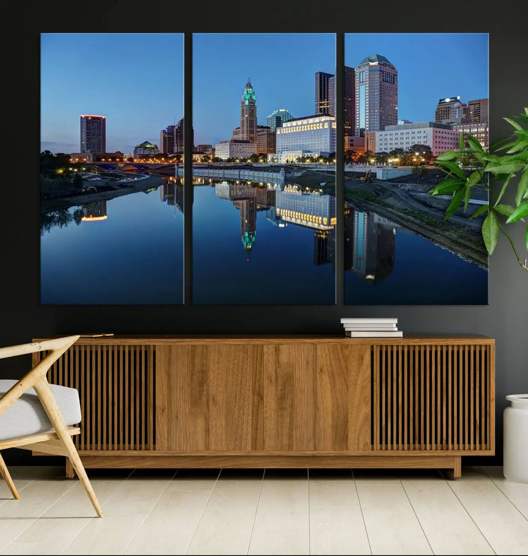 Enhance your modern dining area with the "Columbus City Lights Night Skyline Cityscape View Wall Art Canvas Print," capturing an urban scene of a cityscape mirrored on a tranquil river at dusk. This museum-quality canvas includes a UV-protective coating, guaranteeing its long-lasting brilliance. Enjoy free shipping while adding this piece of urban tranquility to your home.