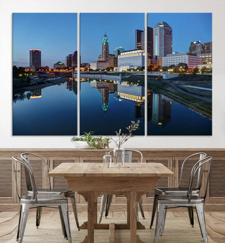 Enhance your modern dining area with the "Columbus City Lights Night Skyline Cityscape View Wall Art Canvas Print," capturing an urban scene of a cityscape mirrored on a tranquil river at dusk. This museum-quality canvas includes a UV-protective coating, guaranteeing its long-lasting brilliance. Enjoy free shipping while adding this piece of urban tranquility to your home.