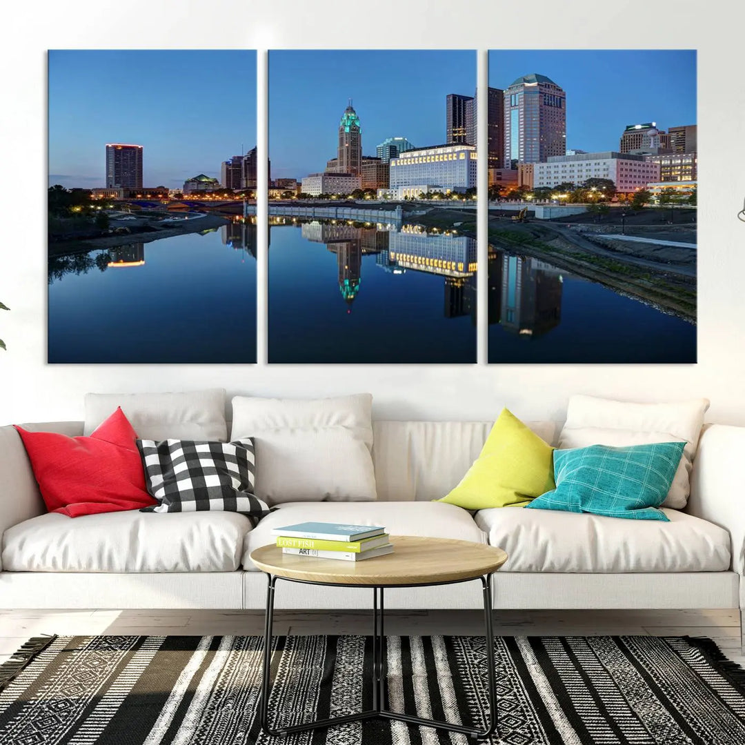 Enhance your modern dining area with the "Columbus City Lights Night Skyline Cityscape View Wall Art Canvas Print," capturing an urban scene of a cityscape mirrored on a tranquil river at dusk. This museum-quality canvas includes a UV-protective coating, guaranteeing its long-lasting brilliance. Enjoy free shipping while adding this piece of urban tranquility to your home.