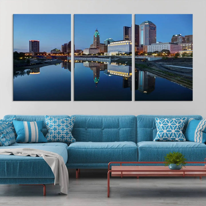 Enhance your modern dining area with the "Columbus City Lights Night Skyline Cityscape View Wall Art Canvas Print," capturing an urban scene of a cityscape mirrored on a tranquil river at dusk. This museum-quality canvas includes a UV-protective coating, guaranteeing its long-lasting brilliance. Enjoy free shipping while adding this piece of urban tranquility to your home.