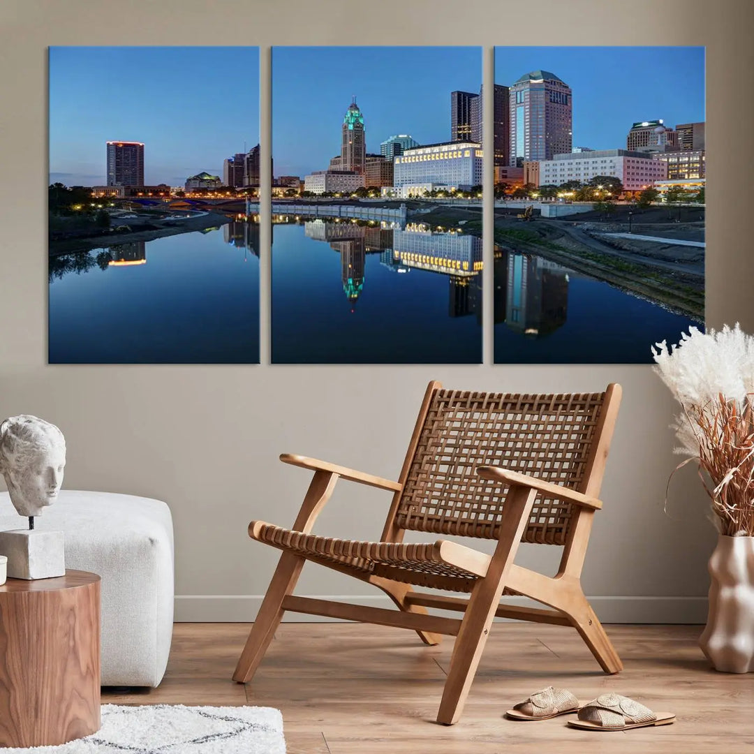 Enhance your modern dining area with the "Columbus City Lights Night Skyline Cityscape View Wall Art Canvas Print," capturing an urban scene of a cityscape mirrored on a tranquil river at dusk. This museum-quality canvas includes a UV-protective coating, guaranteeing its long-lasting brilliance. Enjoy free shipping while adding this piece of urban tranquility to your home.