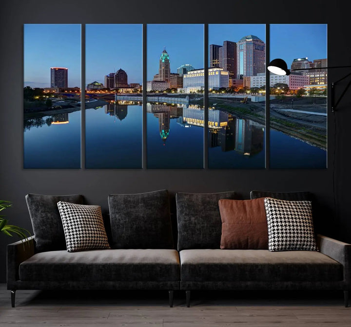 Enhance your modern dining area with the "Columbus City Lights Night Skyline Cityscape View Wall Art Canvas Print," capturing an urban scene of a cityscape mirrored on a tranquil river at dusk. This museum-quality canvas includes a UV-protective coating, guaranteeing its long-lasting brilliance. Enjoy free shipping while adding this piece of urban tranquility to your home.