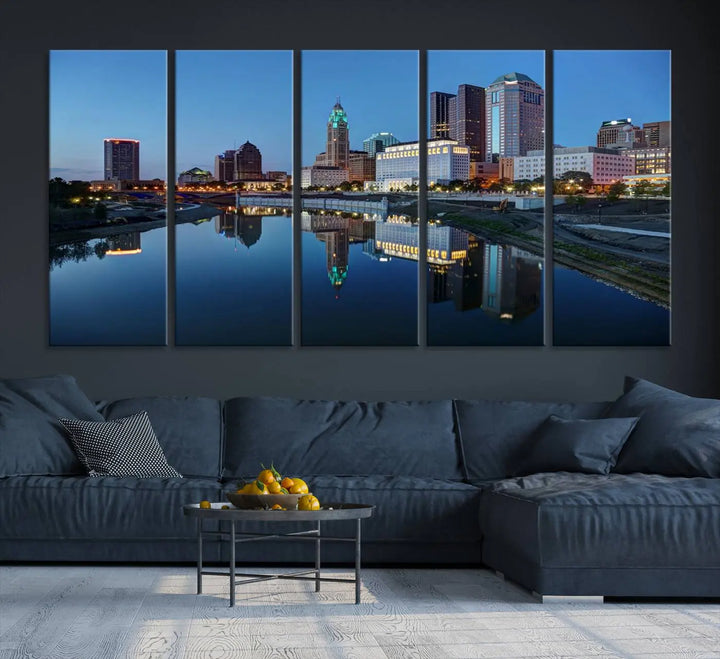 Enhance your modern dining area with the "Columbus City Lights Night Skyline Cityscape View Wall Art Canvas Print," capturing an urban scene of a cityscape mirrored on a tranquil river at dusk. This museum-quality canvas includes a UV-protective coating, guaranteeing its long-lasting brilliance. Enjoy free shipping while adding this piece of urban tranquility to your home.