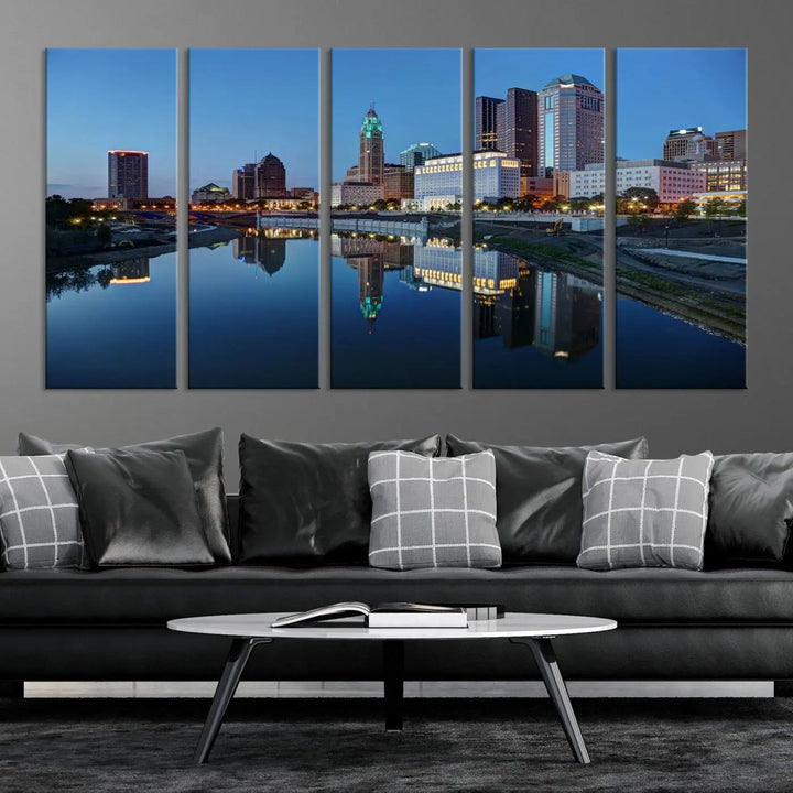 Enhance your modern dining area with the "Columbus City Lights Night Skyline Cityscape View Wall Art Canvas Print," capturing an urban scene of a cityscape mirrored on a tranquil river at dusk. This museum-quality canvas includes a UV-protective coating, guaranteeing its long-lasting brilliance. Enjoy free shipping while adding this piece of urban tranquility to your home.