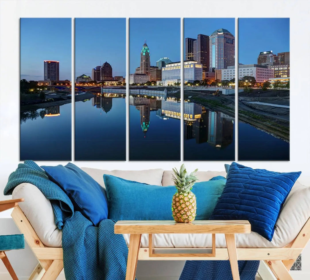 Enhance your modern dining area with the "Columbus City Lights Night Skyline Cityscape View Wall Art Canvas Print," capturing an urban scene of a cityscape mirrored on a tranquil river at dusk. This museum-quality canvas includes a UV-protective coating, guaranteeing its long-lasting brilliance. Enjoy free shipping while adding this piece of urban tranquility to your home.