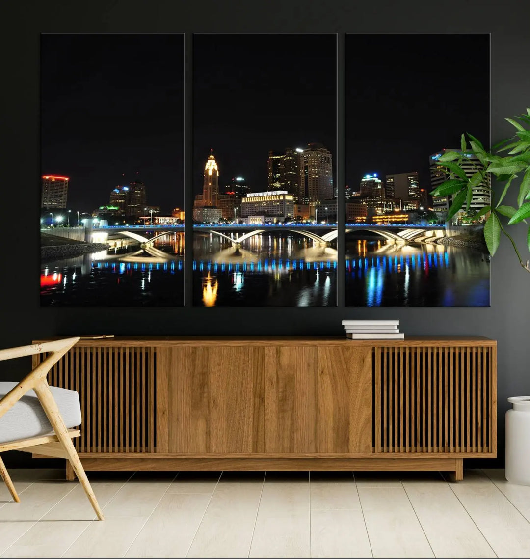 The "Columbus City Lights Night Skyline Cityscape View Wall Art Canvas Print" adorns the living room wall. This artwork, with its vibrant depiction of a night view, is gallery wrapped on museum-quality canvas, enhancing the room's elegance.