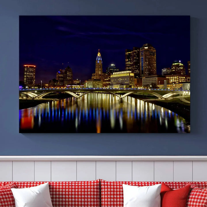 The "Columbus City Lights Night Skyline Cityscape View Wall Art Canvas Print" showcases a stunning city skyline at night, with illuminated buildings and bridges reflecting in the river, on a museum-quality canvas ready to hang.