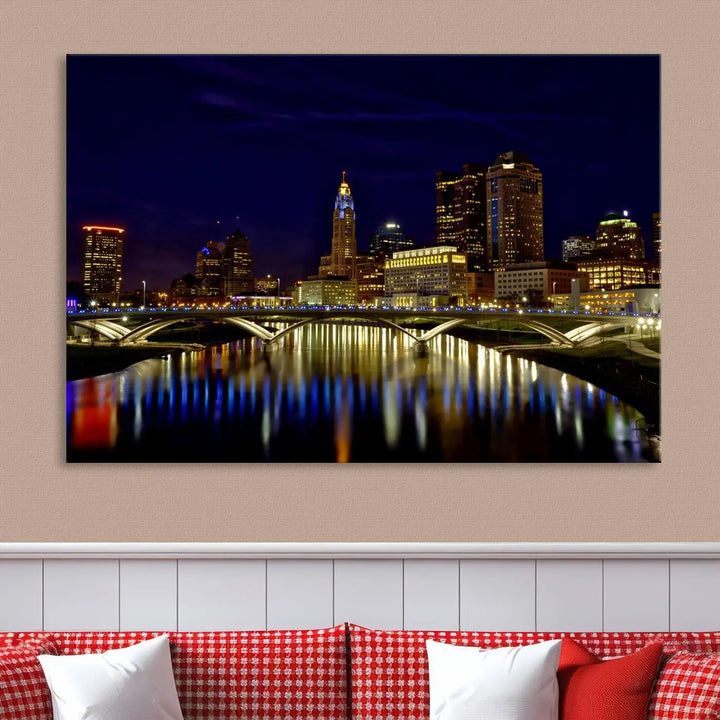 The "Columbus City Lights Night Skyline Cityscape View Wall Art Canvas Print" showcases a stunning city skyline at night, with illuminated buildings and bridges reflecting in the river, on a museum-quality canvas ready to hang.